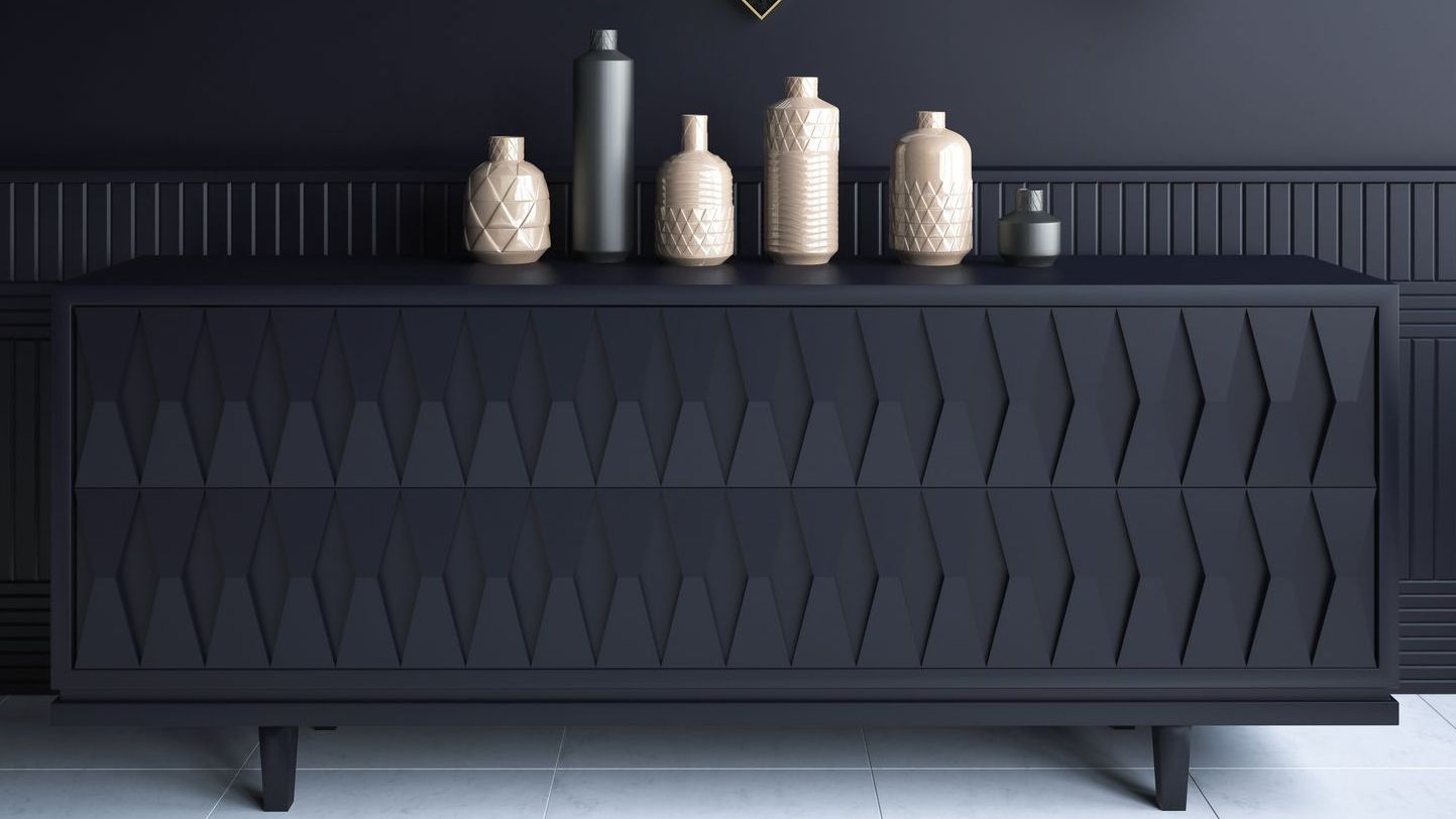 A bedroom with a black dresser and soft neutrals A bedroom with a black dresser and soft neutrals