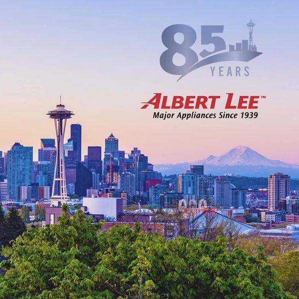 Credit: Albert Lee An Albert Lee banner with the Seattle background