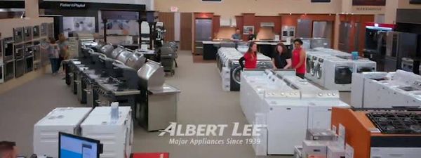 Credit: Albert Lee A wide shot of an Albert Lee appliance showroom with the company banner overlay