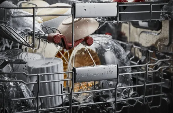 A close-up of dishes inside the KitchenAid KDTM704KPS dishwasher 