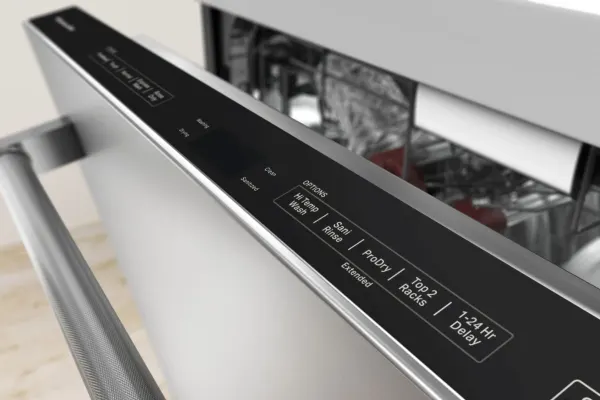A close-up of the KitchenAid KDTM604KPS dishwasher