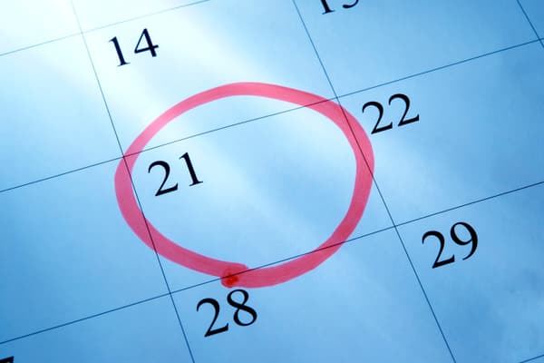 A calendar with the 21st day of a month circled in red 