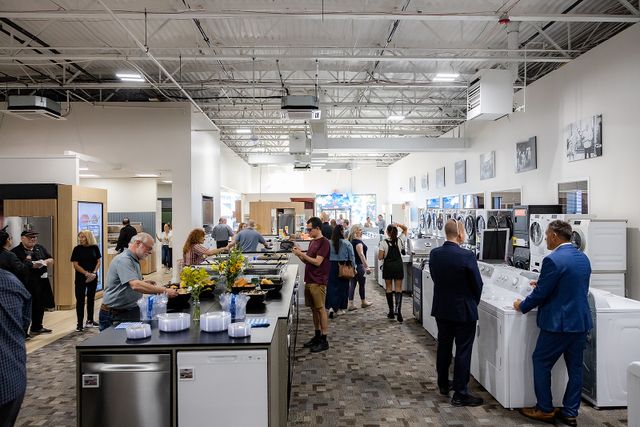 Front view of the inside of Gerhard's new King of Prussia showroom with customers walking about.
