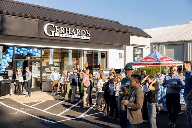 Front view of a line of people waiting outside for Gerhard's King of Prussia store gand opening