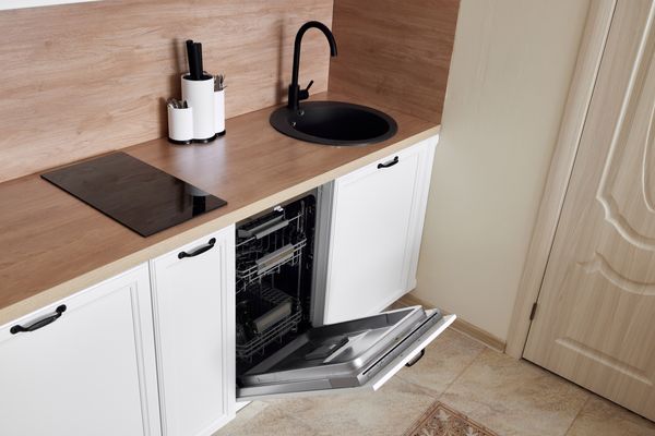 An open 18" dishwasher 