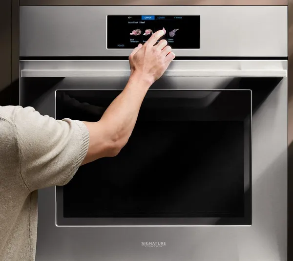 A person using a SKS oven