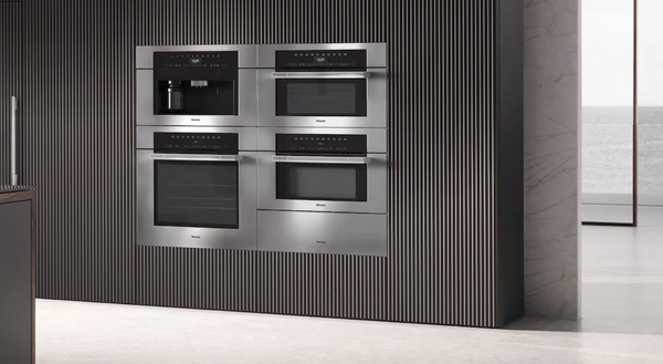 A kitchen featuring Miele ovens