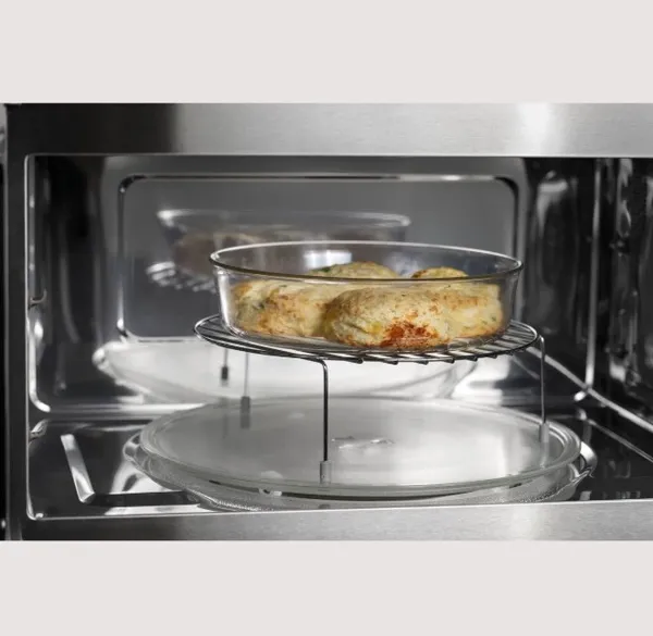Credit: GE Profile A close-up of an entrée cooking inside the GE Profile PWB7030SVSS microwave