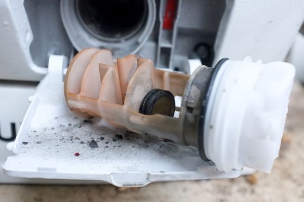 iStock Credit: Pradit_Ph A close-up of a broken washer drain pump