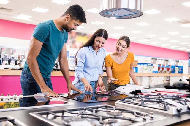 Front view of a couple shopping for a new appliance