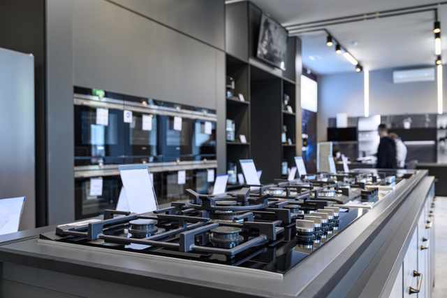 Gas cooktops and wall ovens in an appliance store Gas cooktops and wall ovens in an appliance store