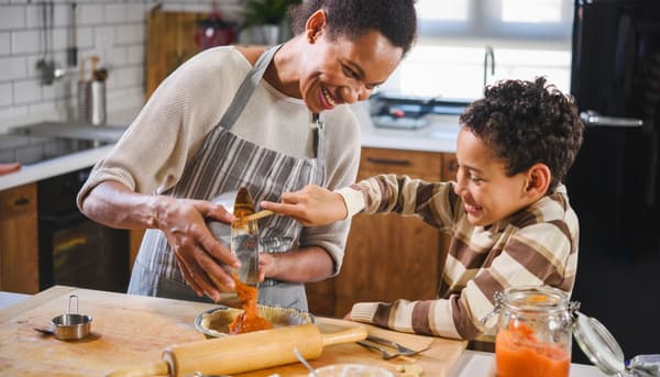 A mother and child baking together