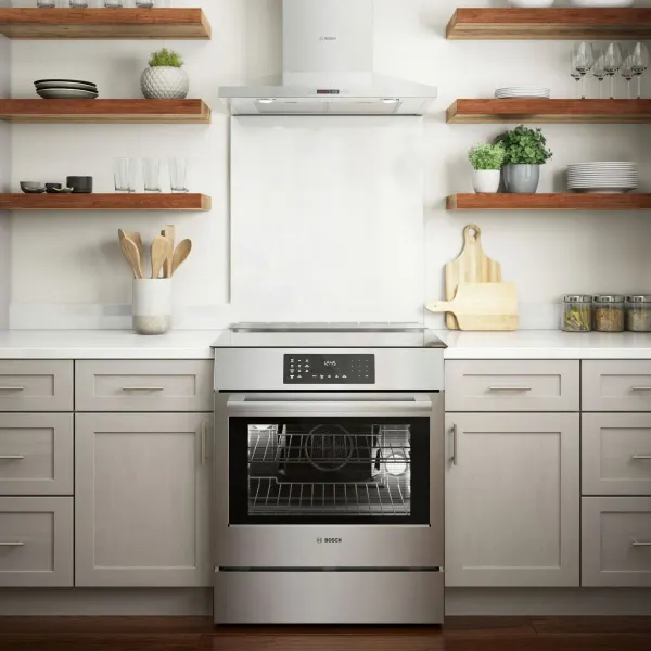 Bosch Benchmark Range Bosch Benchmark induction range installed in a kitchen beneath a Bosch wall mounted Range hood
