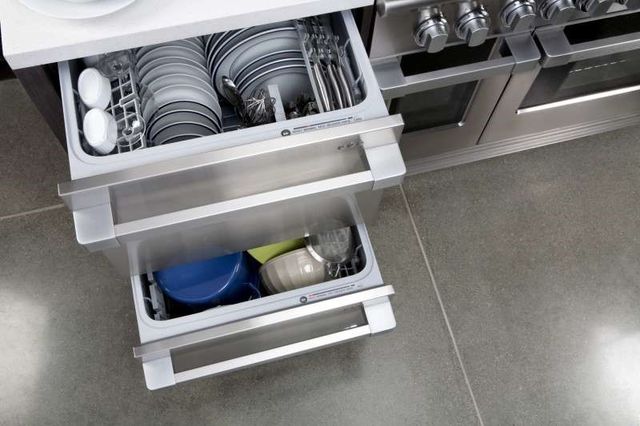 Front view of an opened double drawer dishwasher