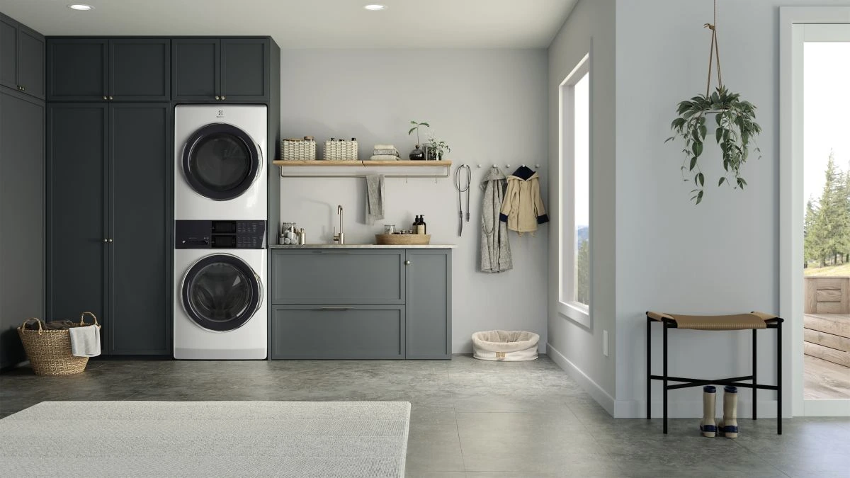Electrolux The Electrolux 600 Series ELTE7600AW stacked washer in a laundry room