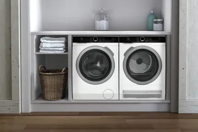 The Electrolux ELFW4222AW washer and dryer pair in a laundry room 