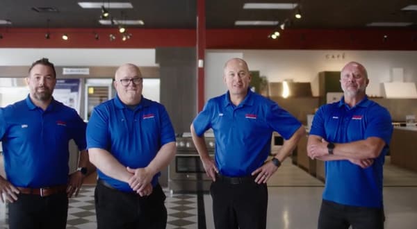 Fred’s Appliance employees helping a customer