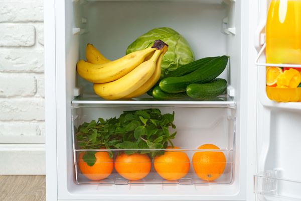 A close-up of produce inside of a compact fridge