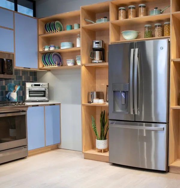 The GE GFE28GYNFS refrigerator in a modern kitchen