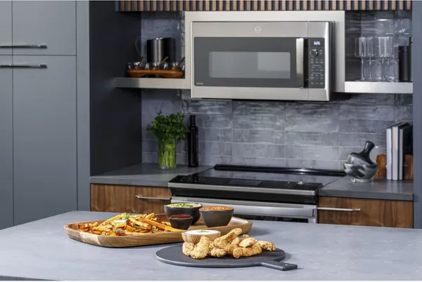 The GE Profile PVM9179SRSS over the range microwave with a platter of food 