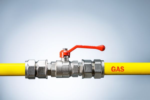A close-up of a yellow gas line 