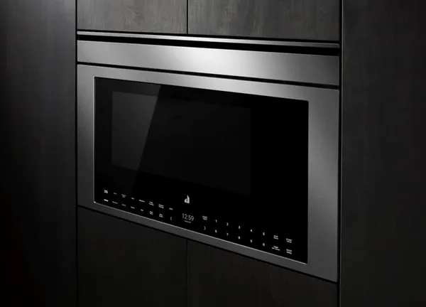Credit: JennAir The JennAir JOETC330SL microwave installed into black cabinets
