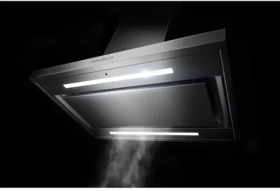 Credit: JennAir The JennAir JVI0636LS range hood capturing vapor against a black background
