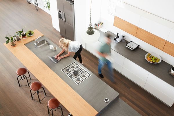 A long exposure of people in a kitchen 