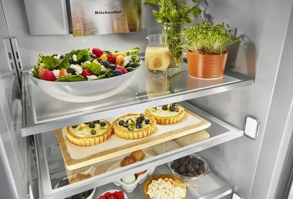 Various foods inside of the KitchenAid KBSD708MPS refrigerator interior  