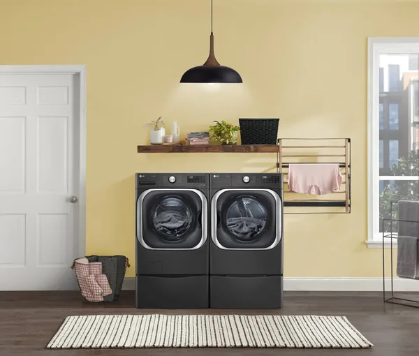 The LG DLEX8900B washer and dryer in a laundry room