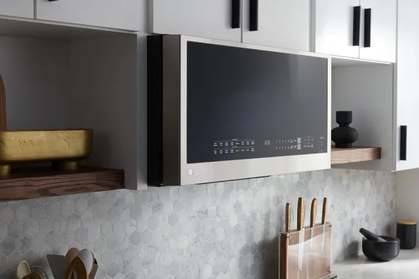Side view of the LG MHEC1737F microwave in a kitchen 