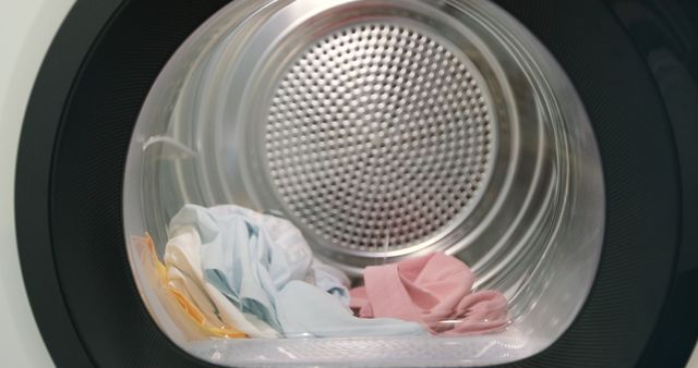 Front view of clothes laying in a perm press dryer