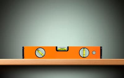 A leveling tool on a shelf 
