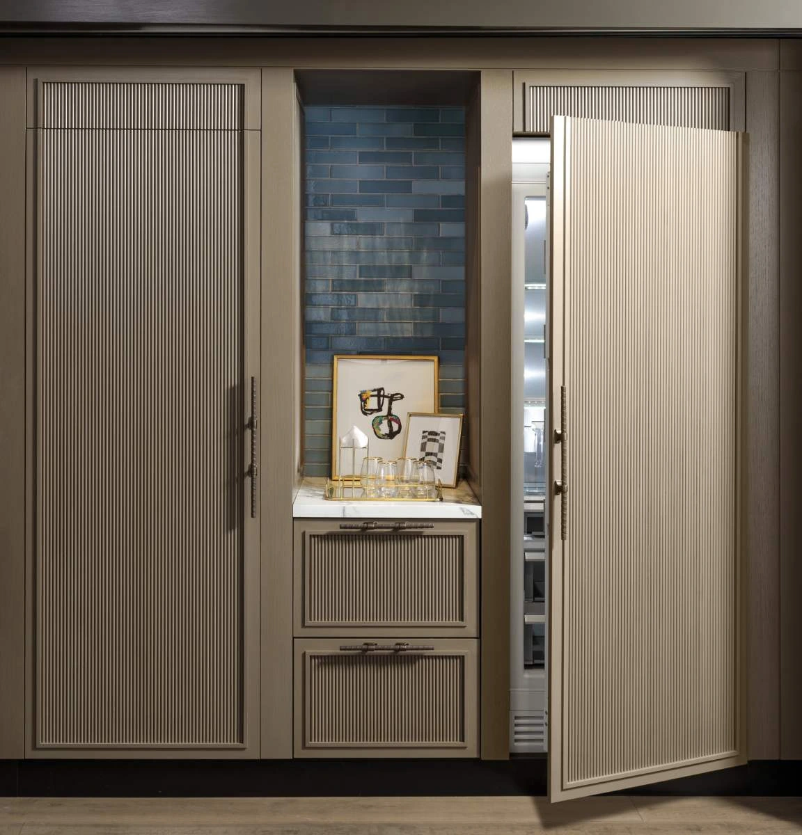 The Monogram ZIR301NPNII column refrigerator and matching freezer column in a luxury kitchen