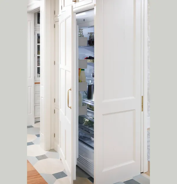 An open Monogram ZIR361NBRII refrigerator 