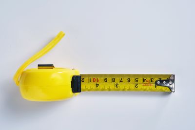 An overhead view of an extended tape measure