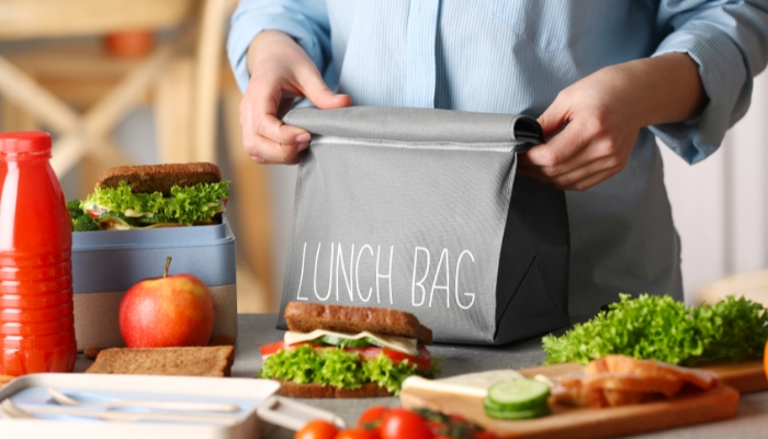 App_Lunch-Packing-Tips_5.jpg Packing sandwiches in containers to go into a lunch bag