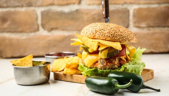 Place setting with nachos and a burger