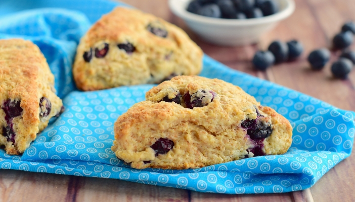 A close-up of fruit scones on a plate.