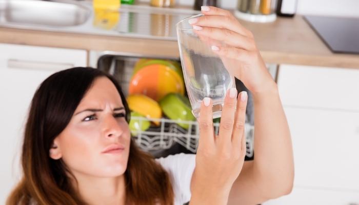 App_Places-Odors-Lurk_3.jpg Woman studying clean glass as if it’s still dirty