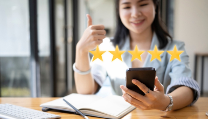 App_Appliance-Shopping-FAQs_4.jpg Woman checking out reviews on her phone