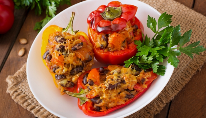 An overhead shot of a plate of stuffed peppers.