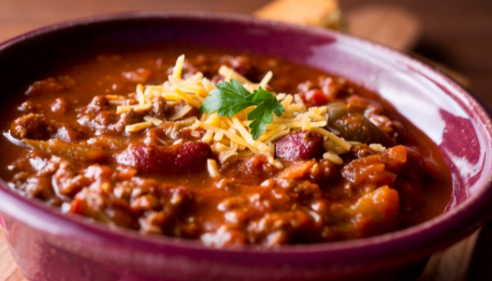 A closeup of a bowl of hot chili.