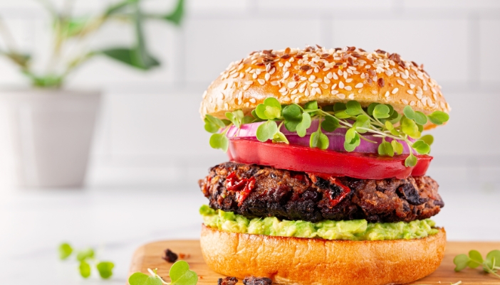 A sideview of a black bean burger.