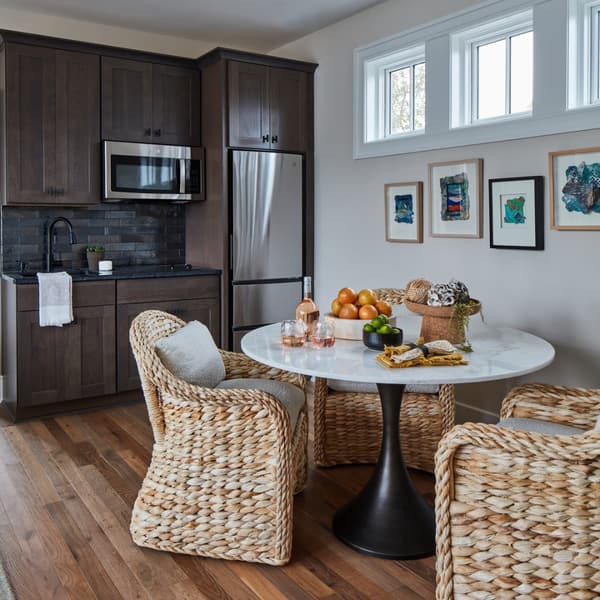 A GE refrigerator next to a breakfast nook A GE refrigerator next to a breakfast nook