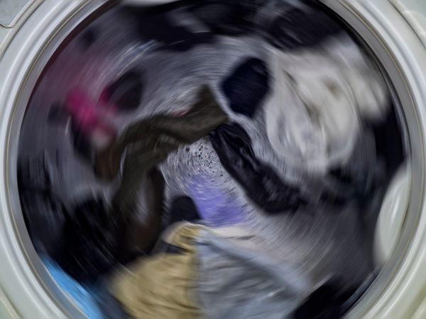 iStock Credit: Skarie20 An action shot of a washer spinning