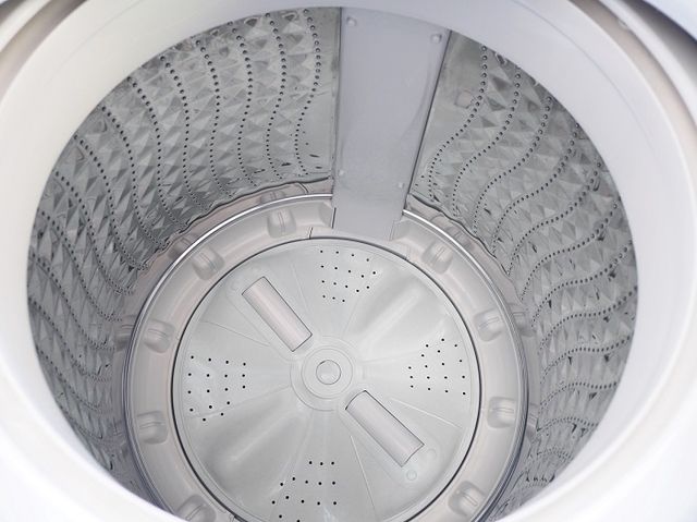 Top view of the inside of a washer with impeller 