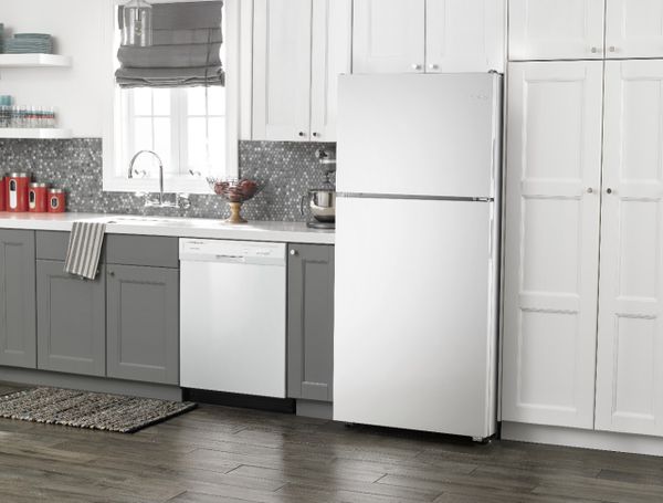 The Whirlpool ADB1300AFW refrigerator in a kitchen