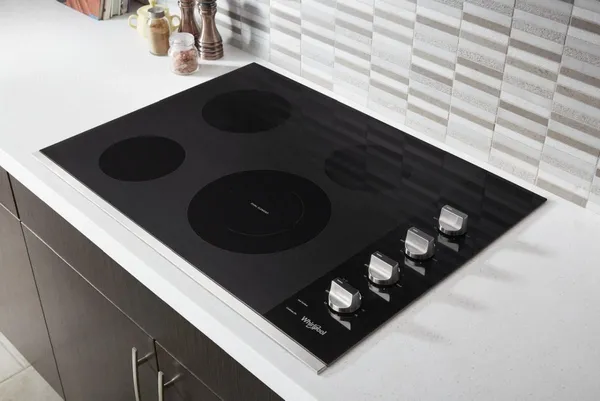 Overhead view of the Whirlpool WCE55US0HS cooktop in a modern kitchen 