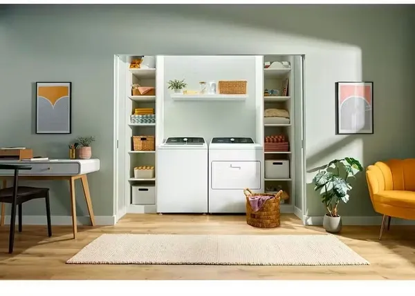 The Whirlpool WTW5025SW washer and matching dryer in a laundry room